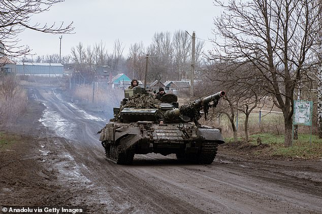 A T-64 tank passes through Novoselivka Persha after leaving Avdiivka, Ukraine