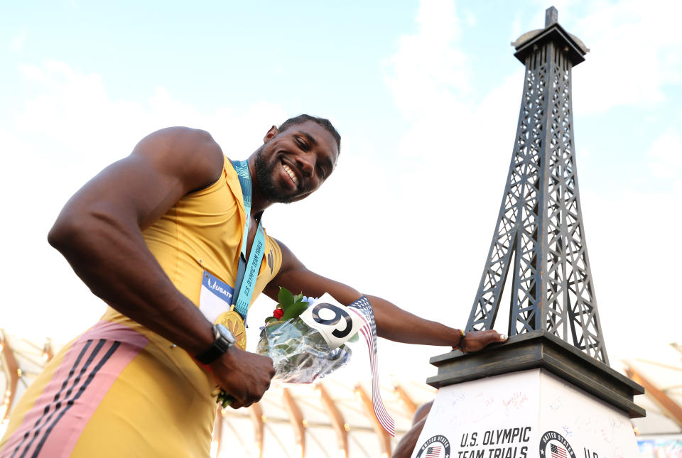 Lyles poses with a miniature Eiffel Tower after winning the 200 meters at the U.S. trials. (Christian Petersen/Getty Images)