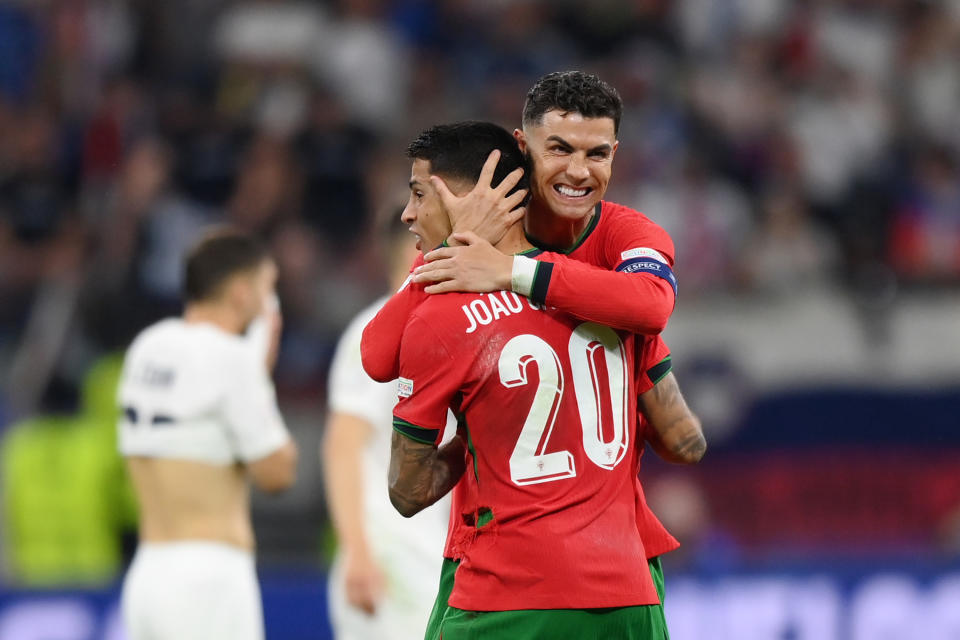 Cristiano Ronaldo and Joao Cancelo celebrate after the victory. (Justin Setterfield/Getty Images)