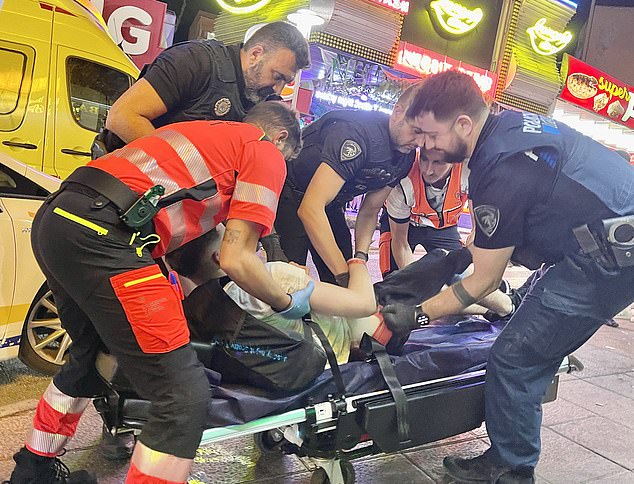 Paramedics rushed to the scene on the famous Punta Bellena strip to place the man on a stretcher before loading him into an ambulance for treatment for suspected alcohol poisoning.