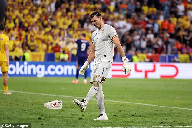 Nita kicked another of the shoes in frustration as Romania's Euro 2024 campaign ended