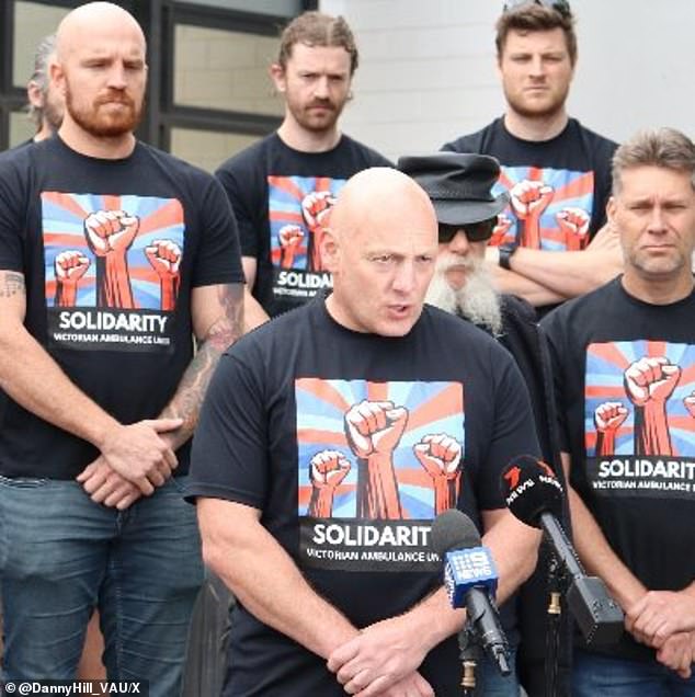 Victorian Ambulance Union secretary Danny Hill (pictured centre) said paramedics working an 18-hour shift were not an isolated case.