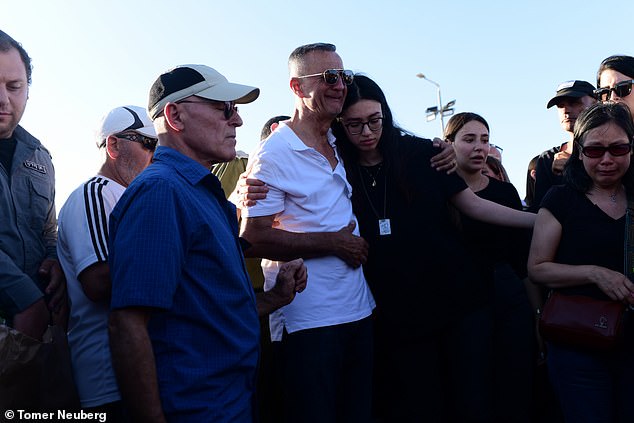 Noa and her father attend the ceremony today in Beer Sheva, southern Israel.