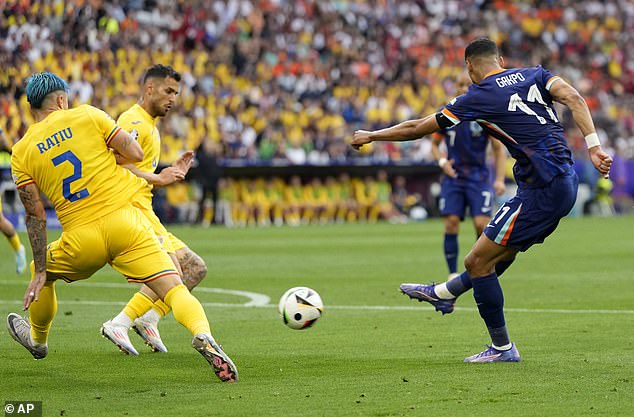 Gakpo (right) scored and provided an assist to help his team seal a 3-0 victory over Romania.