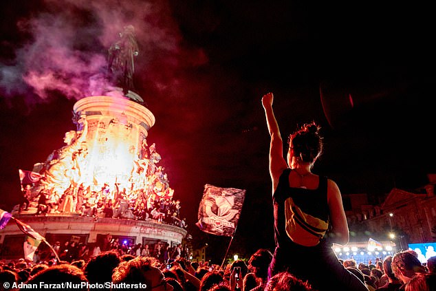 Protesters take part in an anti-RN demonstration following the announcement of the results of the first round of parliamentary elections at the Place de la Republique, Paris, on June 30.