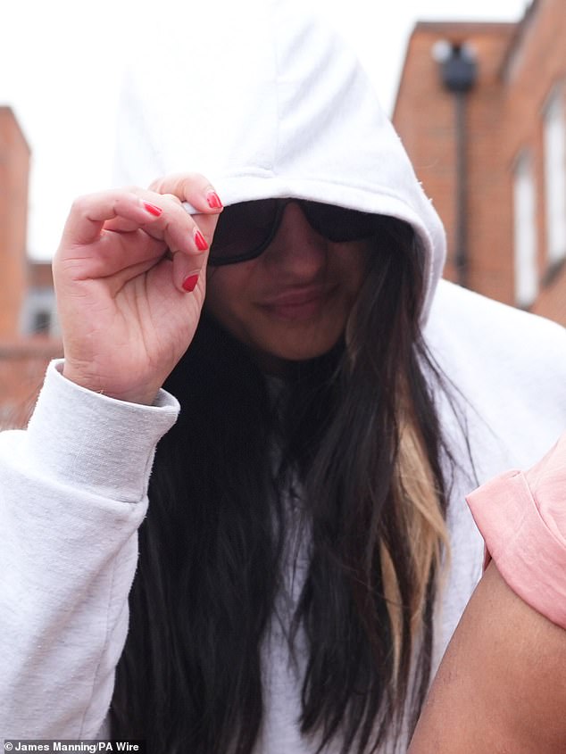 Linda De Sousa Abreu tries to cover her face outside Uxbridge Magistrates' Court yesterday