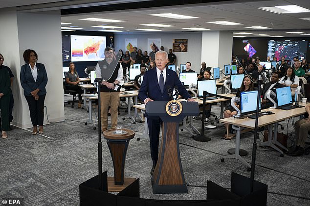 Joe Biden uses teleprompters to discuss extreme weather at the DC Emergency Operations Center in Washington