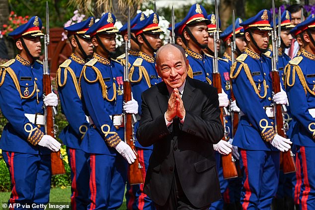 Ms Rinehart received the highest award for non-Cambodian citizens from King Norodom Sihamoni (pictured centre)