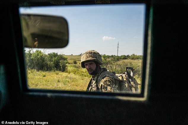 An infantryman trains with a T-80 tank as the war between Russia and Ukraine continues in the Donetsk region.