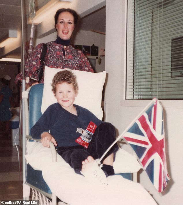 Hamish, patriotic, with a Union flag on his hospital bed. He spent 16 months undergoing treatment 