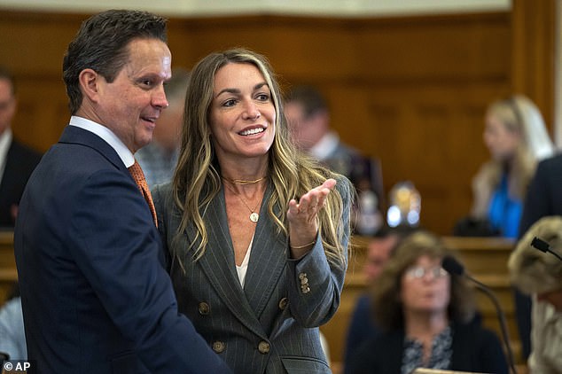 Read and attorney Alan Jackson laugh after recess at Norfolk County Superior Court in Dedham on May 2.