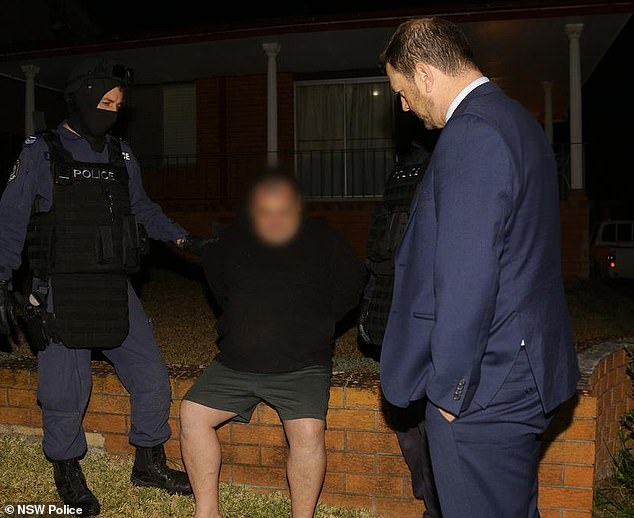 Rebels member Colin Crane (pictured during his arrest in 2018) has had his murder conviction overturned.