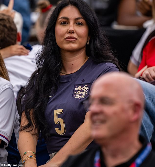 John Stones' partner Olivia Naylor wore two colourful versions of the Magic Alhambra design to complement her England shirt, which bears Stones' shirt number.