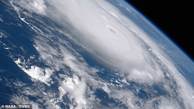 The images show the storm spinning around the Atlantic Ocean with a well-organized eye at the center.