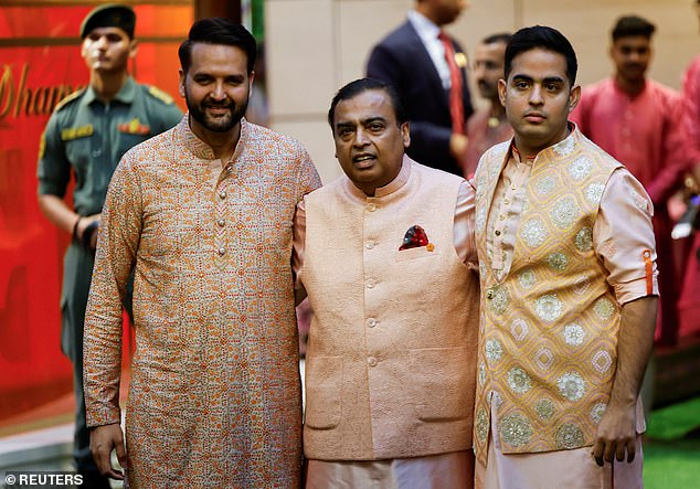 Mukesh Ambani (centre) poses with his son-in-law, Anand Piramal and son Akash Ambani (right), 32.