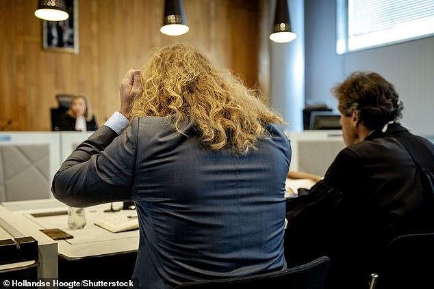 Jonathan and his lawyer Richard van der Zwan sit in court in April 2023 as he was ordered to stop donating sperm to clinics.