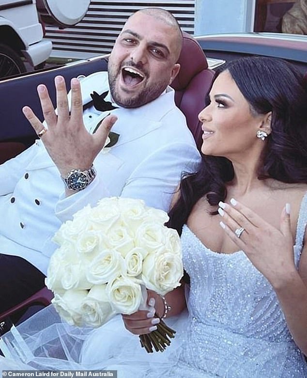 Awad is above with his wife Marina on their wedding day.