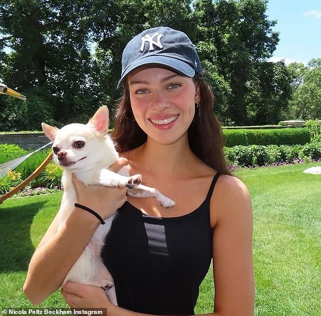 David Beckham's daughter-in-law Nicola Peltz and her dog Nala, who died suddenly after being at the groomers.