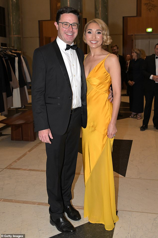 Bank executive Amelia Dobson stood out in her buttercup yellow dress