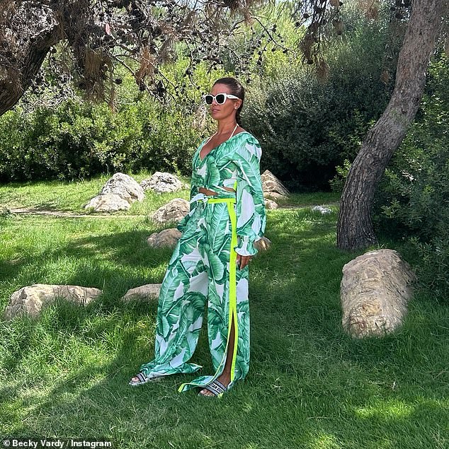 Sharing an album of snaps on Instagram, the brunette beauty flaunted her sensational curves in a jungle palm tree-print wrap top and matching trousers.