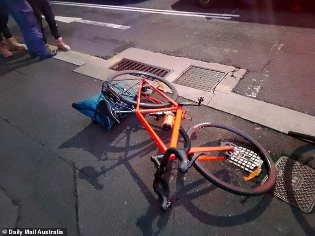 The woman suffered a head injury and was taken to St Vincent's Hospital where she is in a stable condition. The cyclist's bike can be seen in the picture.