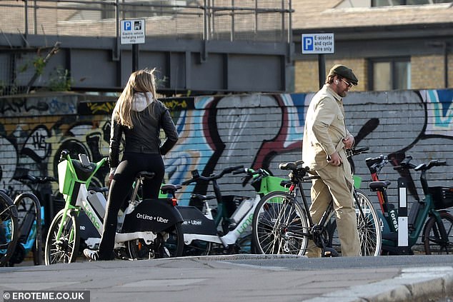 The couple were then photographed grabbing two Lime electric bikes for a ride around London.