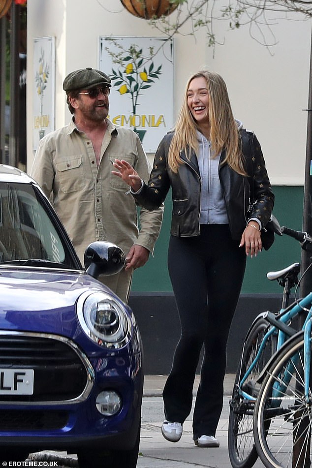 Gerard opted for a khaki ensemble, flat cap and aviator sunglasses for the outing.