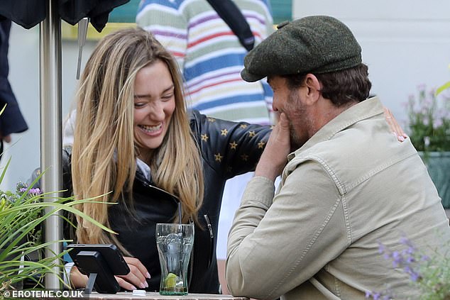 Penny couldn't keep her hands off Gerard during the outing.