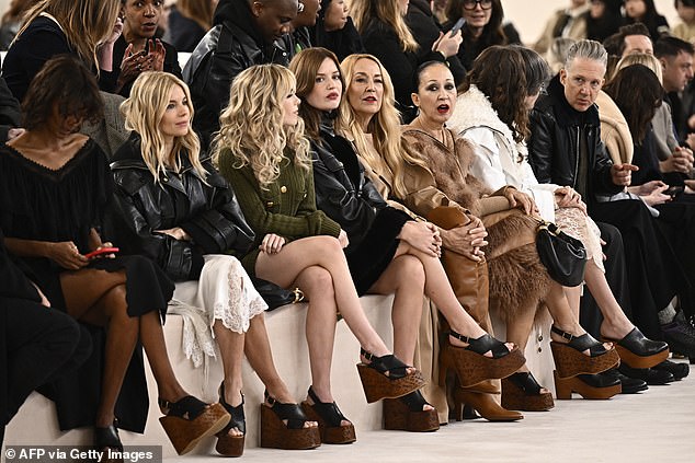 Sienna Miller, left, and Georgia May Jagger, centre, in the front row at Chloe