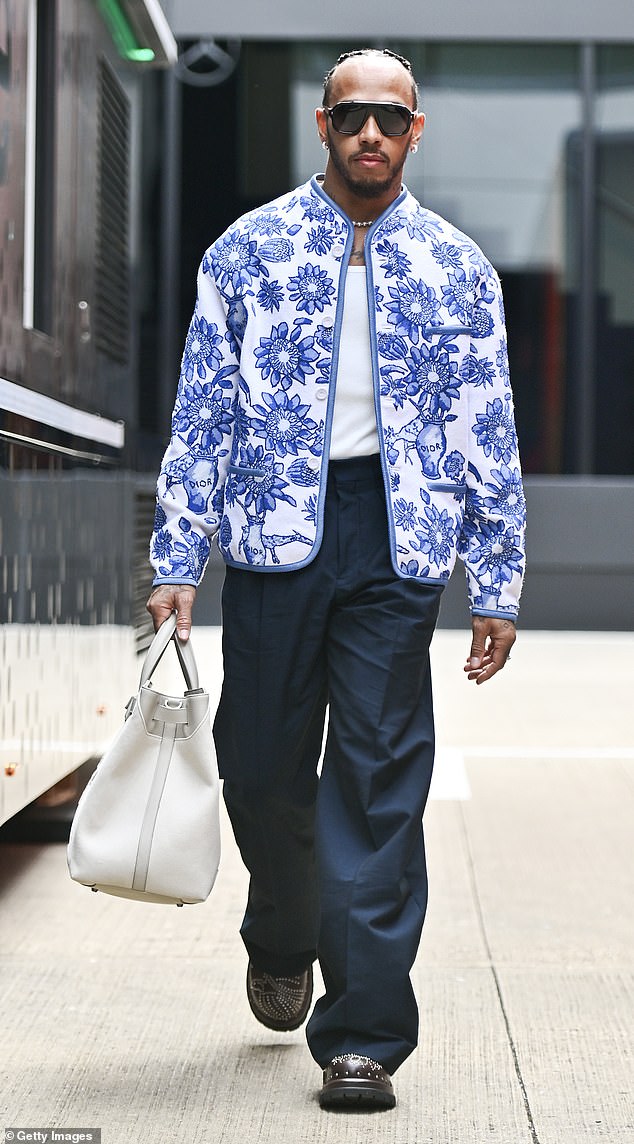 Lewis showed off his sense of style in a blue and white jacket.