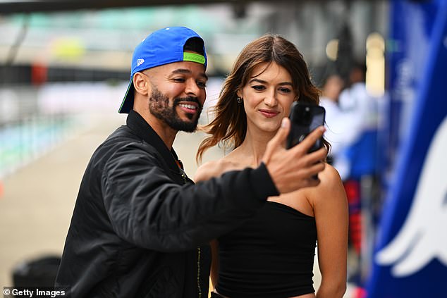 A fan beamed as she took a photo with Daisy as she walked.