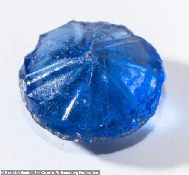 A blue glass button was found, still shining as if it had been newly made.