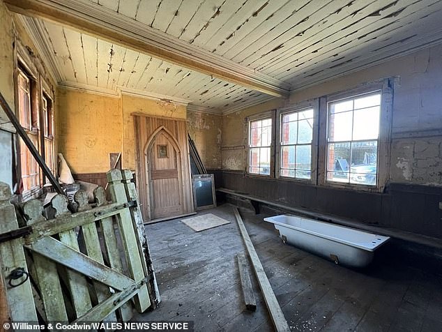 The red and white brick station, located next to a tunnel, is in need of modernisation but could now be converted into housing. Pictured: One of the station halls in need of renovation