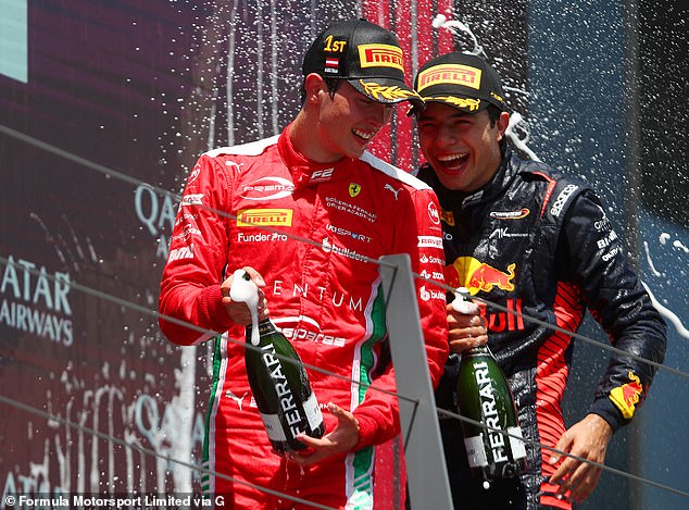 Bearman celebrates with Josep Maria Martí (right) after winning a Formula 2 race in Austria