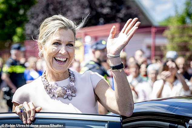 Queen Máxima beamed as she waved to the crowd, clearly enjoying being outdoors on a sunny day.