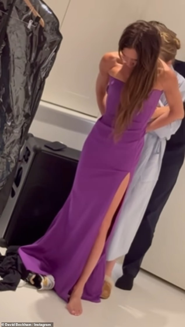 David later shared images of Victoria trying on her dress, with help from her daughter Harper and close friend Ken Paves.