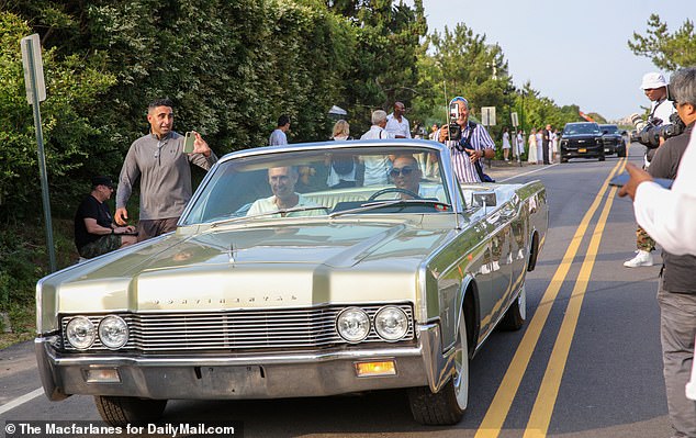 The car was a Lincoln Continental, a means of transportation that stood out among the SUV fleet.