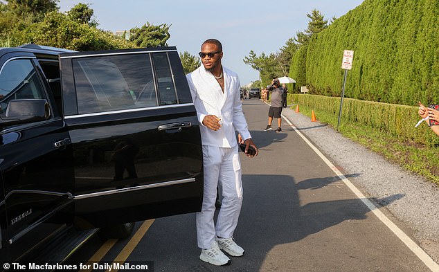 Some were dressed in suits, like these guests, while others were dressed more casually, always in elegant shades of white that fit the dress code.