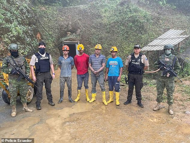 Ecuadorian soldiers and police guard four of the 49 miners who were rescued on Wednesday