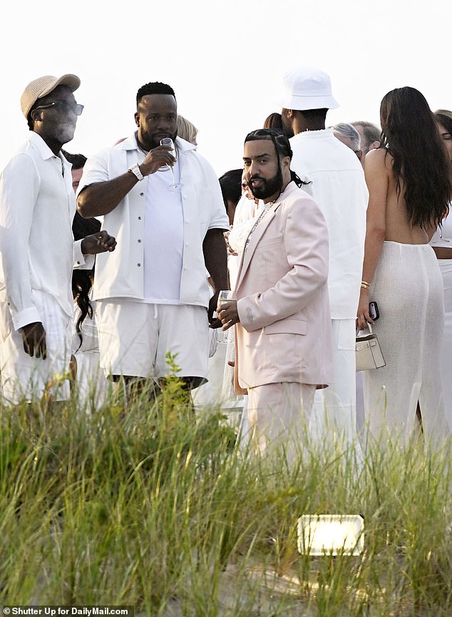 Rapper French Montana appeared to deviate slightly from the dress code, wearing a white and pink suit.