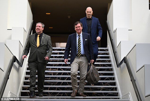 Carlson (centre) arrives to address the Australian Freedom Conference at the Hyatt Hotel in Canberra