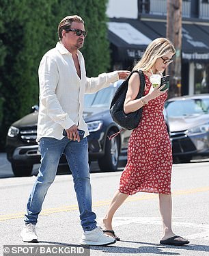 For her date, Stewart dressed smartly, sporting a cream linen shirt with the top buttons undone and jeans.