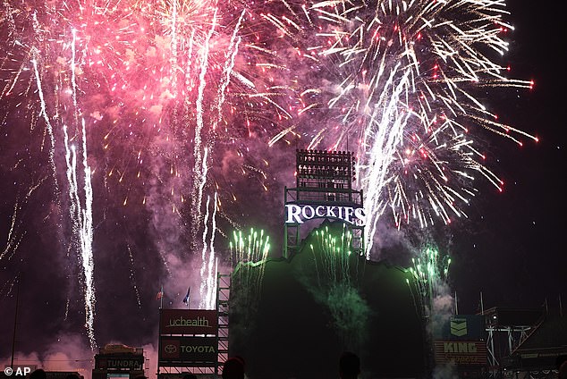 Fireworks light up the sky over Coors Field to commemorate the Independence Day holiday after the Colorado Rockies defeated the Milwaukee Brewers in a baseball game Thursday, July 4, 2024, in Denver.