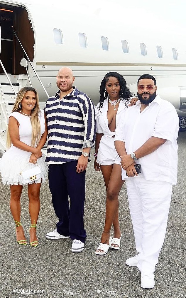 (right to left) DJ Khaled, Remy Ma and Fat Joe posed with Joe's wife, Lorena Cartagena, in front of the private jet that would take them to the Hamptons.