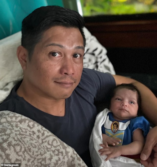 Two-month-old baby Diana Sofia De Los Santos, pictured with her father Romer, died after being left in the back of a hot car.