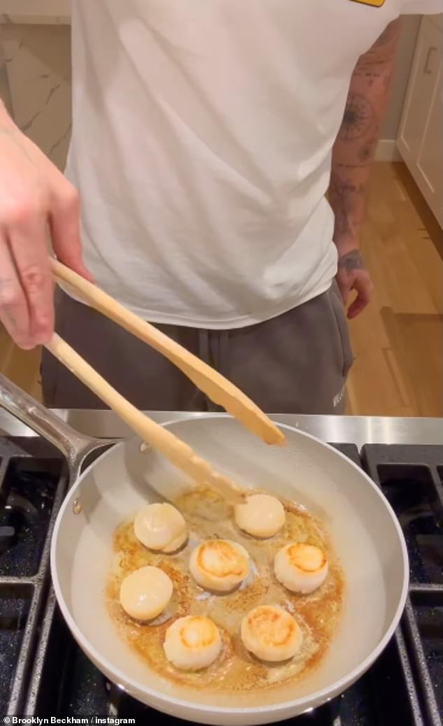 David and Victoria Beckham's eldest son skillfully chopped onions and garlic before frying scallops to accompany the dish.