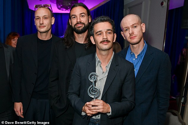 The newly engaged singer, who recently proposed to his girlfriend Gabbriette, posed for photos after receiving the gong.