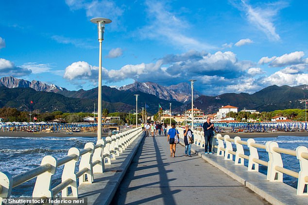 Kate explores the resort's pier (pictured), which stretches 275 metres out into the Ligurian Sea.