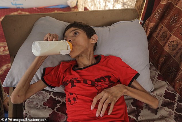 In a third photo, Ahmed is seen drinking what appears to be milk from a bottle as he looks into the distance.