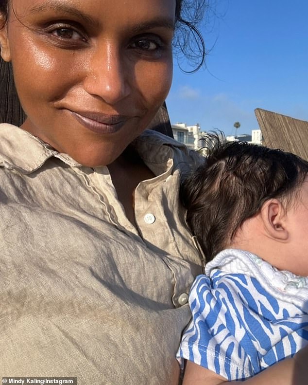 Earlier in the day, Mindy gave fans a glimpse of her Independence Day celebrations, which included a snap of the actress smiling beatifically at the camera while cradling her newborn daughter Anne, whose face was left out of frame.